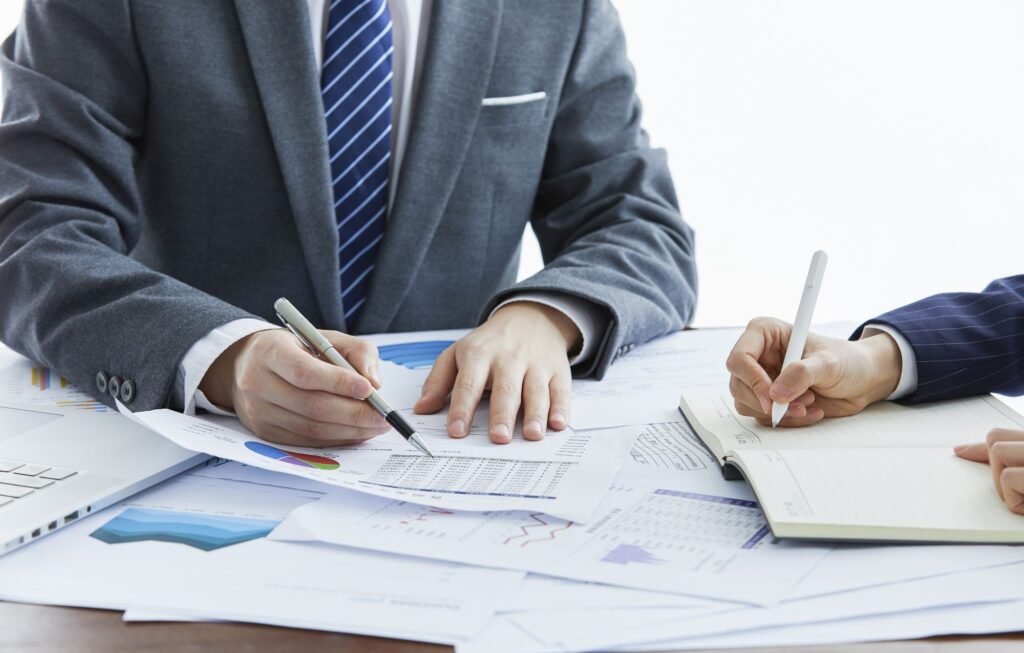 Business consultants meeting in Dubai office discussing tax and company setup services