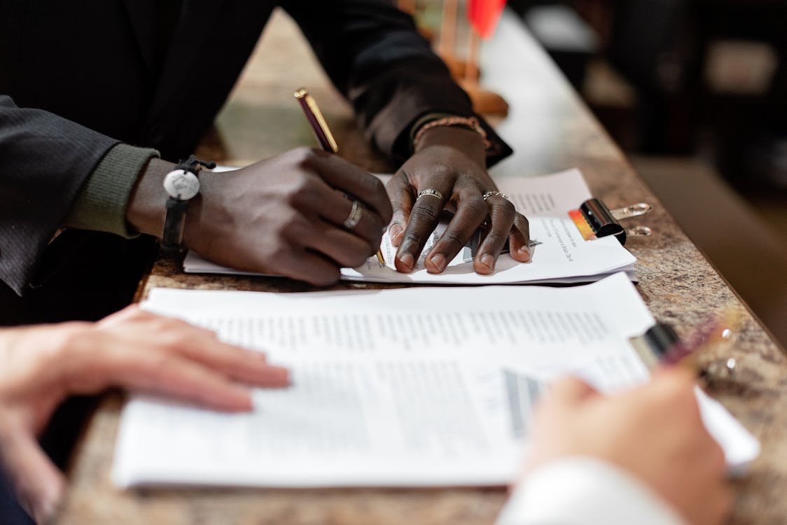Business professionals signing UAE bank account opening documents in 2026