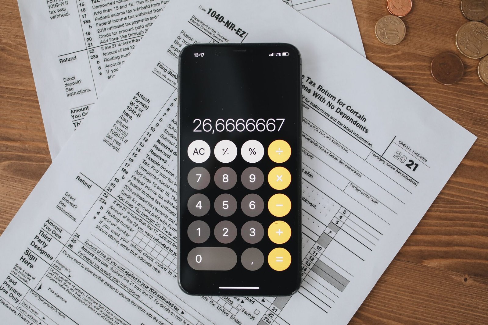 Tax forms and calculator representing UAE Cabinet Decision 129 of 2025 unified corporate tax, VAT, and excise penalty framework