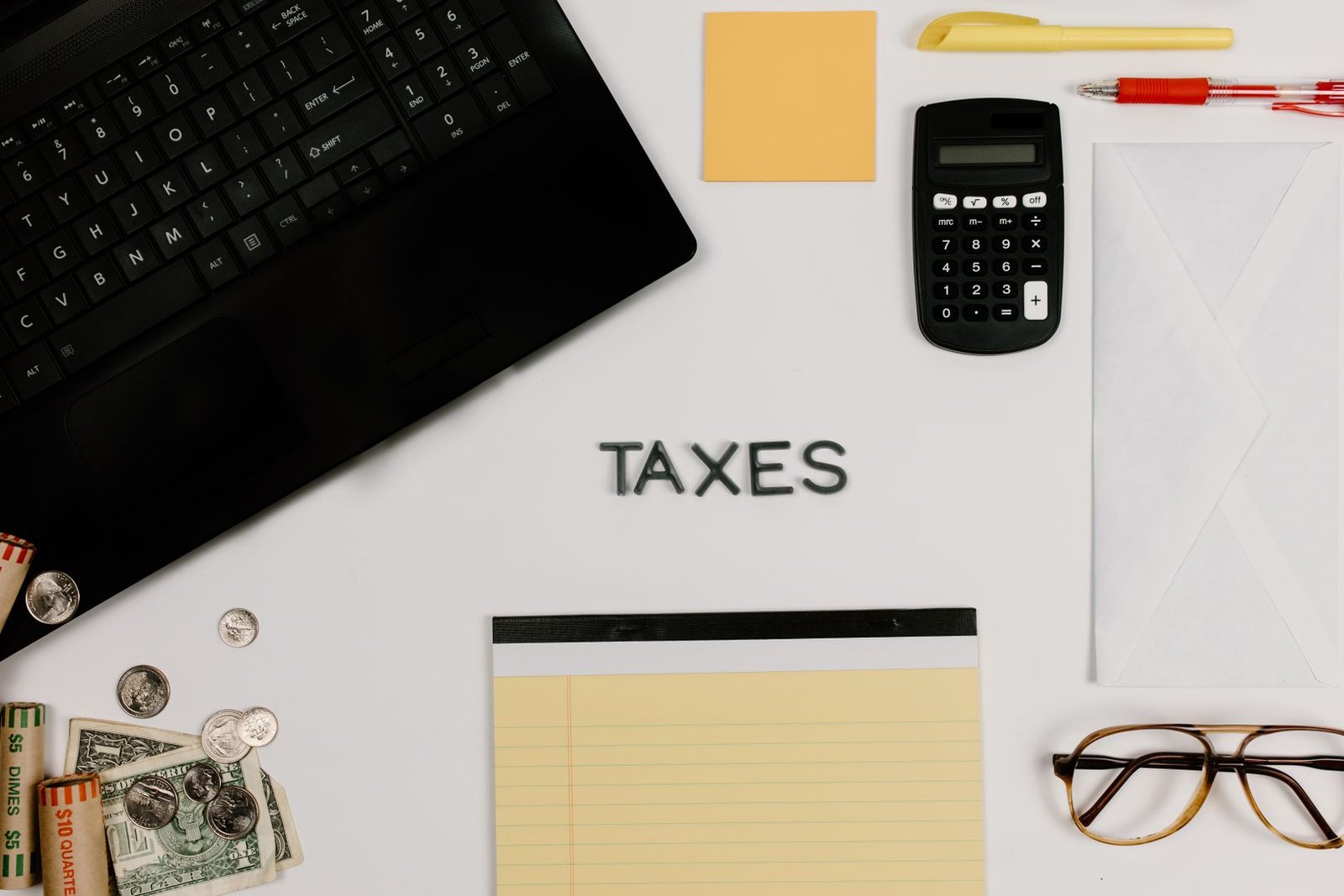 Corporate finance professionals reviewing tax documents in an office, representing UAE Withholding Tax compliance under Article 45