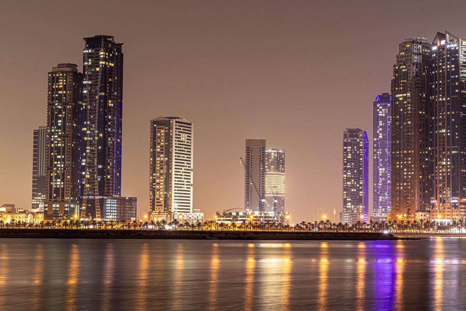 UAE waterfront skyline at night, representing Fujairah free zone company setup and business formation in the UAE