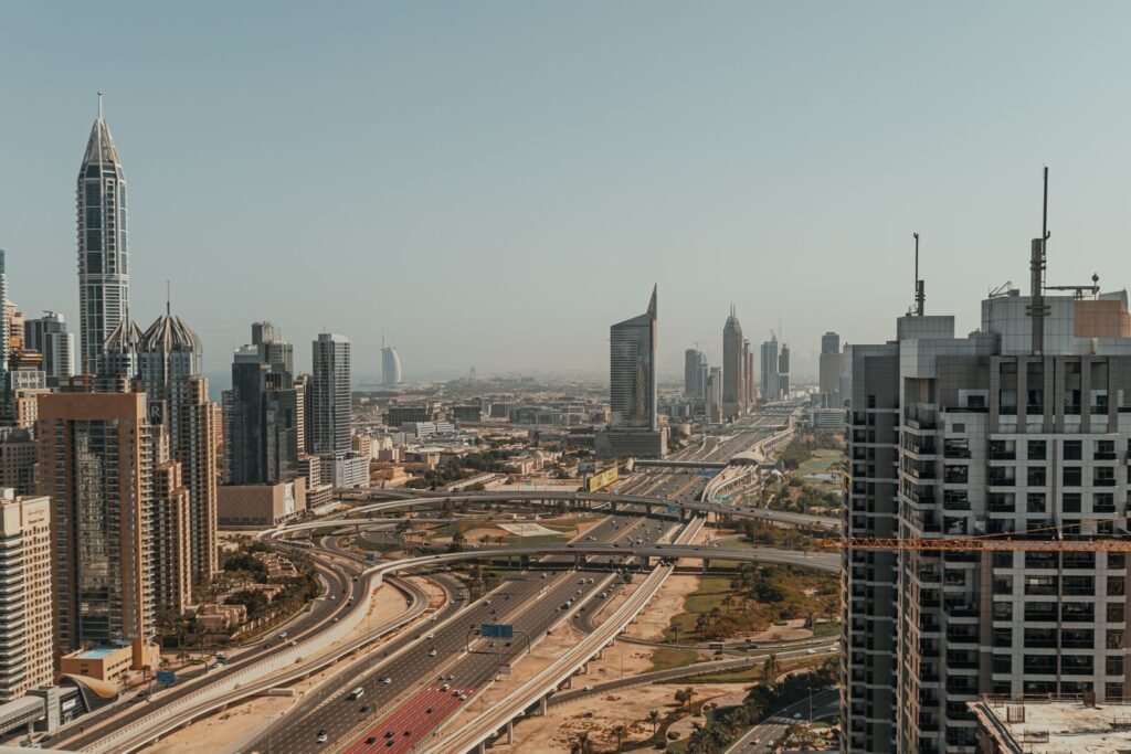 Aerial view of Dubai's skyscrapers and highways, representing UAE free zone business setup