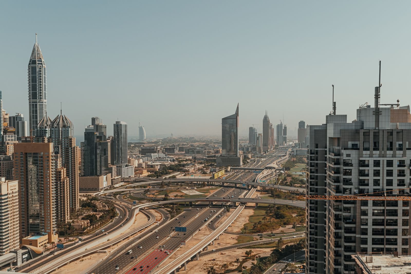 Aerial view of Dubai's skyscrapers and highways, representing UAE free zone business setup