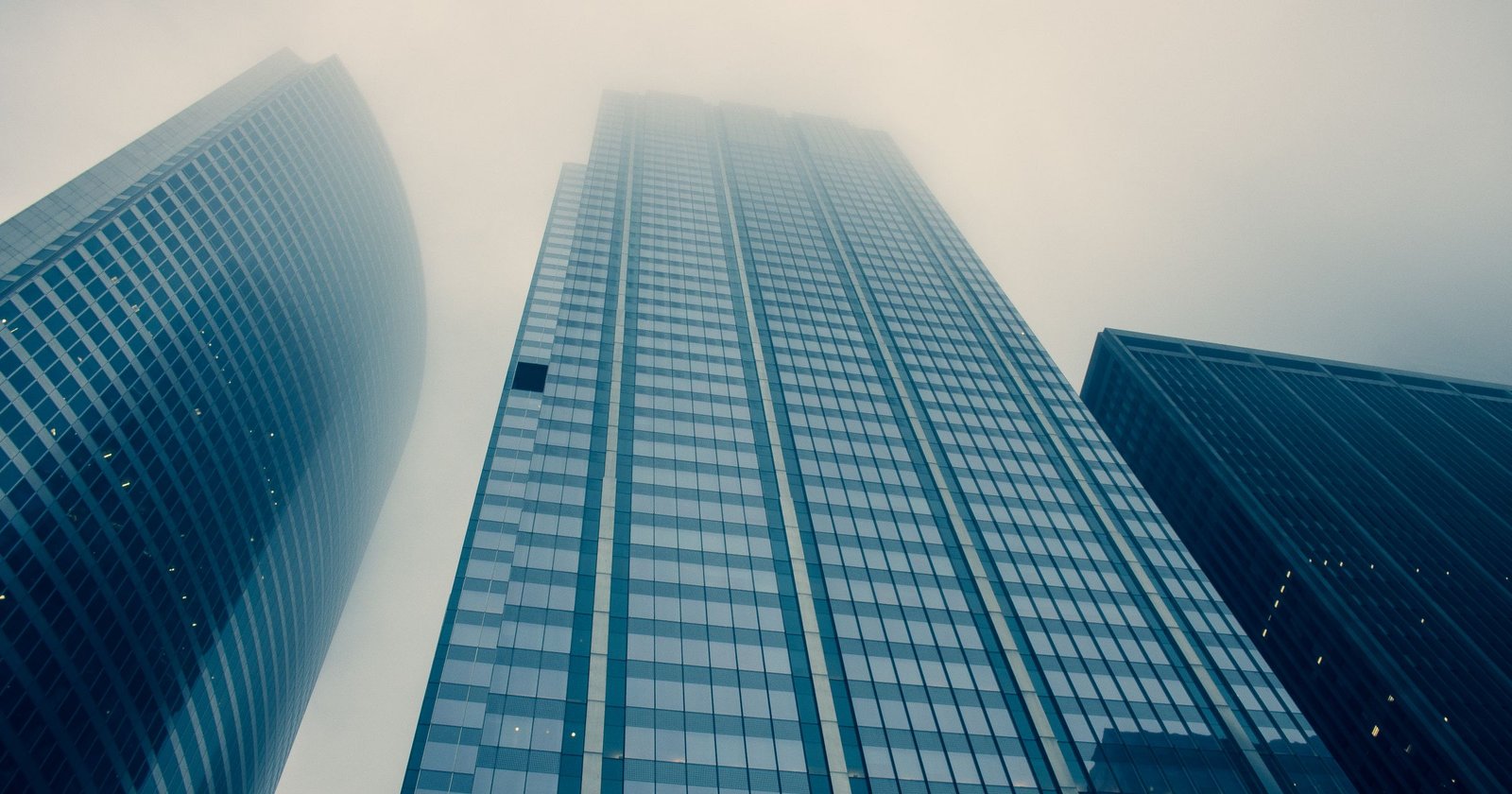 Modern financial district office towers representing UAE Corporate Tax and Free Zone excluded activities
