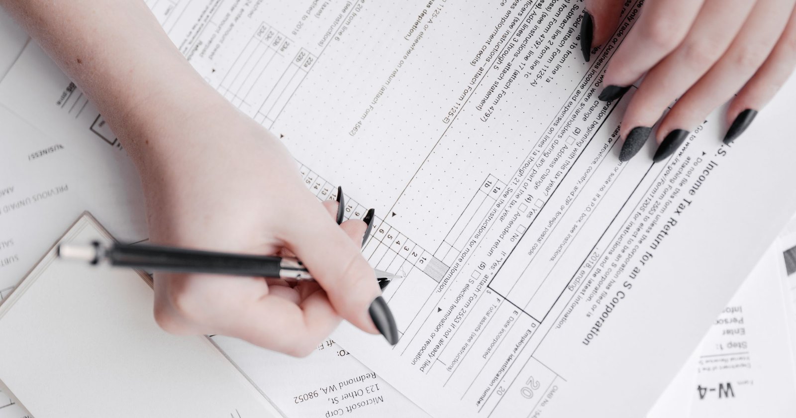Business owner reviewing a tax document and invoice to verify a UAE Tax Registration Number