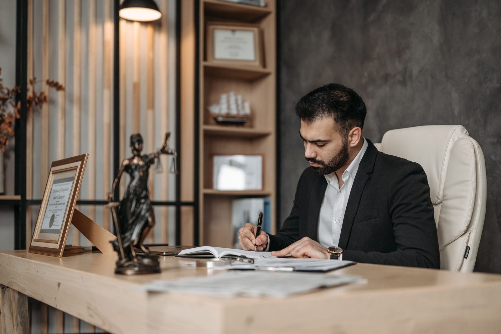 FTA registered tax agent reviewing UAE corporate tax documents in an office