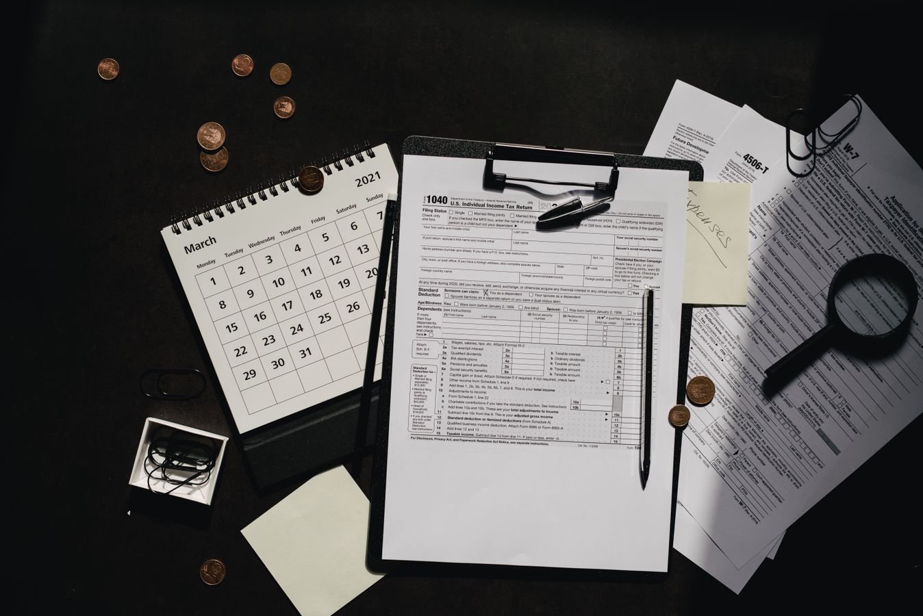 Clipboard with a blank form and a pen, representing UAE VAT audit and tax assessment records