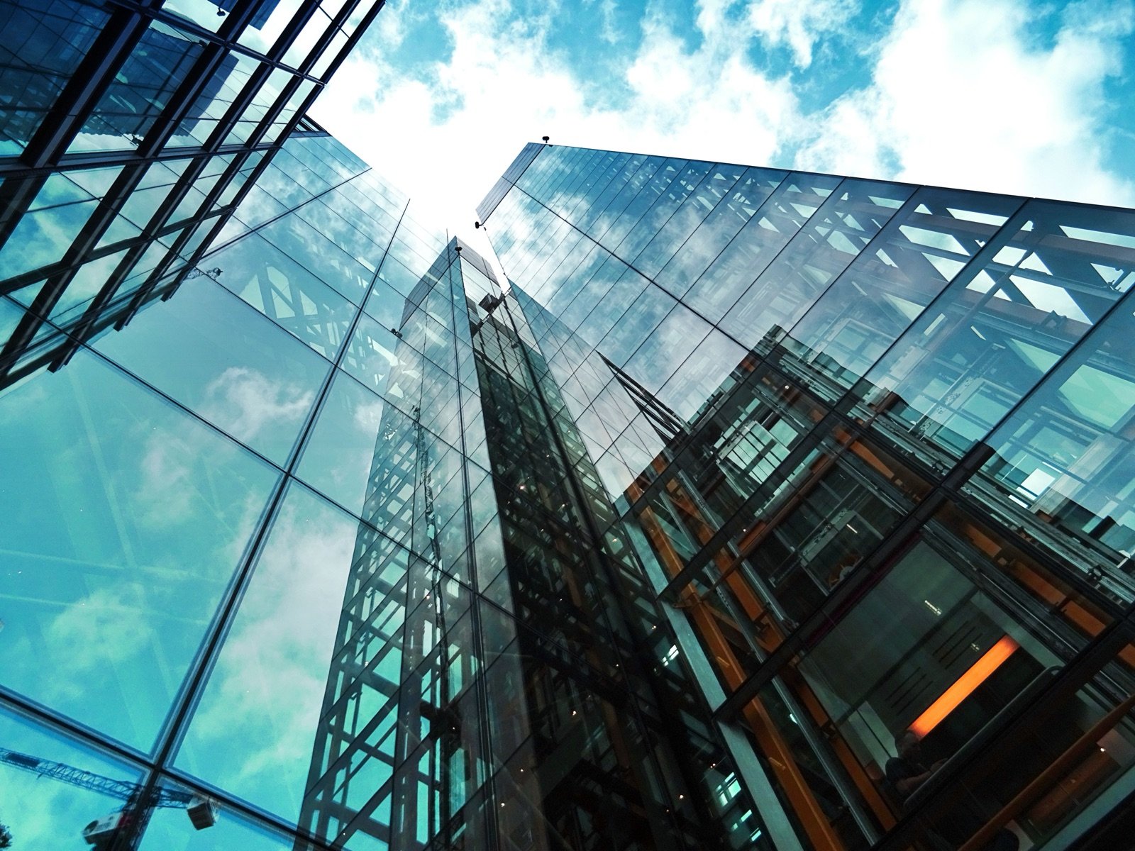 Modern glass skyscraper representing international holding company structures for BVI offshore setups