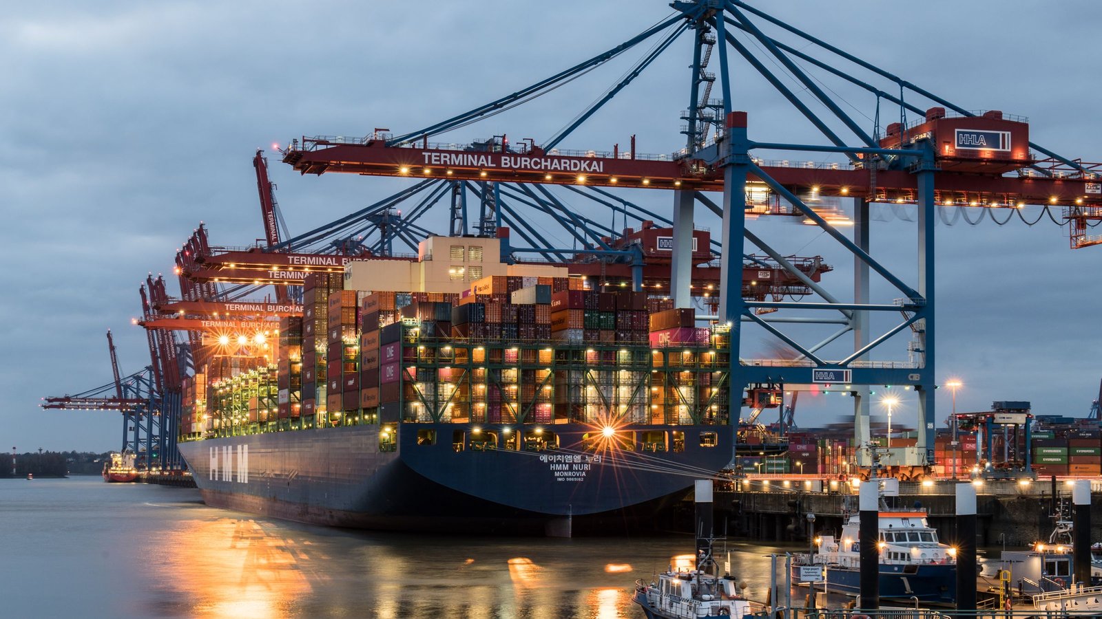 Shipping containers and cargo at a port illustrating UAE customs duty on imported goods