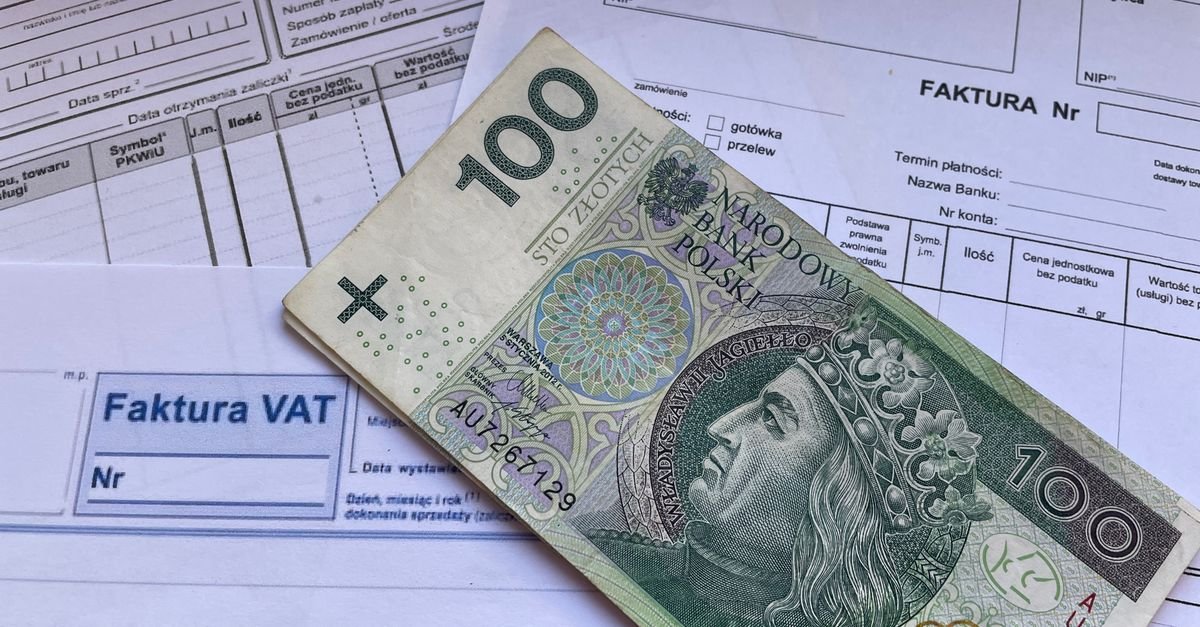 Businessperson reviewing tax invoice documents and receipts, representing UAE VAT disbursement and reimbursement compliance