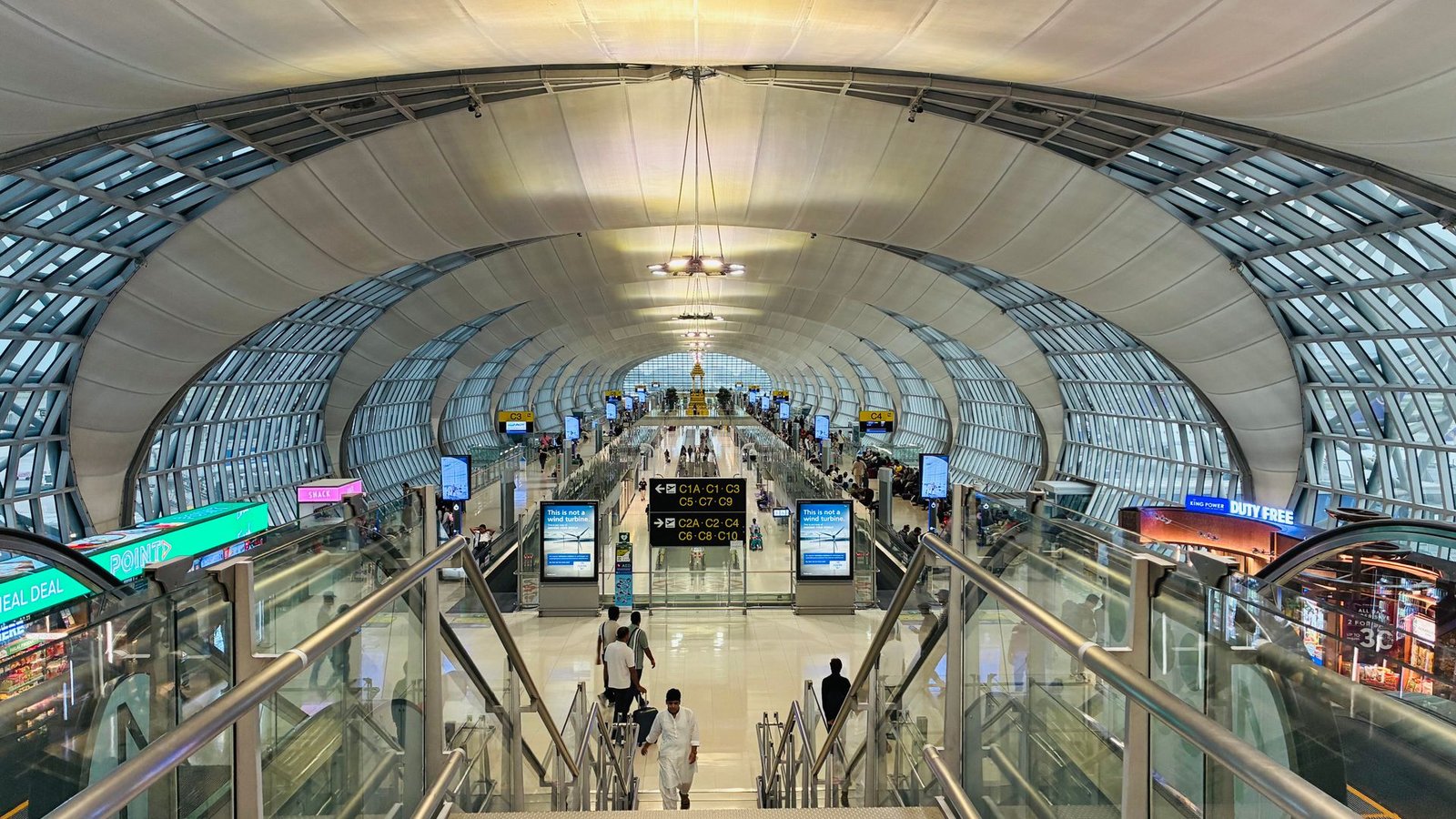 Traveler at airport duty-free shopping area, representing the UAE VAT tourist refund scheme and Planet Payment process