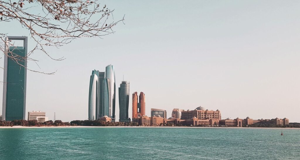 Abu Dhabi skyline with the Etihad Towers and the waterfront, representing an Abu Dhabi mainland company set up through ADDED and TAMM